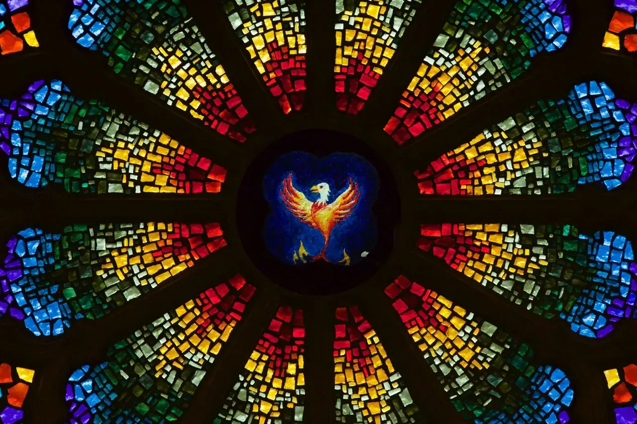 Rose Window with a phoenix in the center.