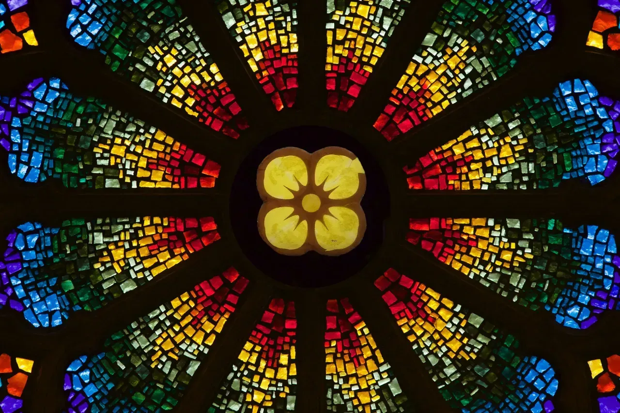 Rose Window with a yellow flower in the center.