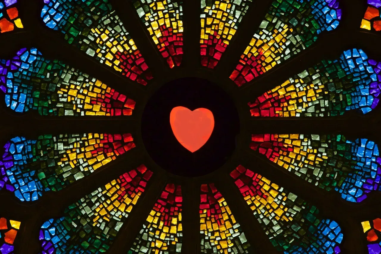 Rose window with a heart in the center.