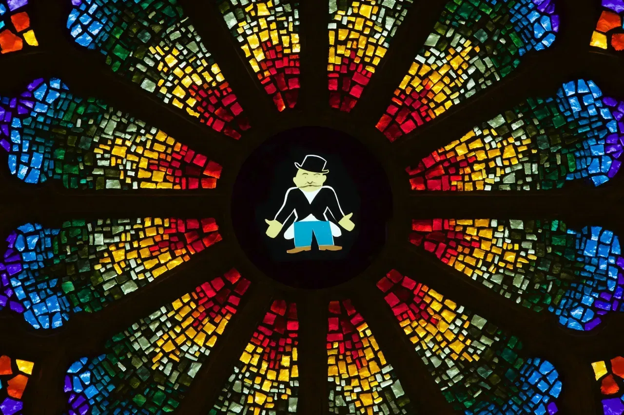 Rose window with the Monopoly man in the center.