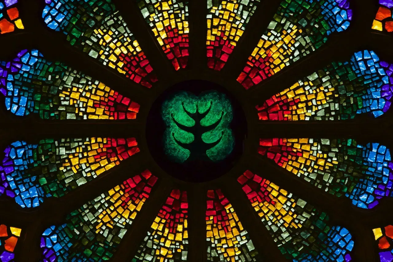 Rose Window with the two forbidden trees of Eden in the center.
