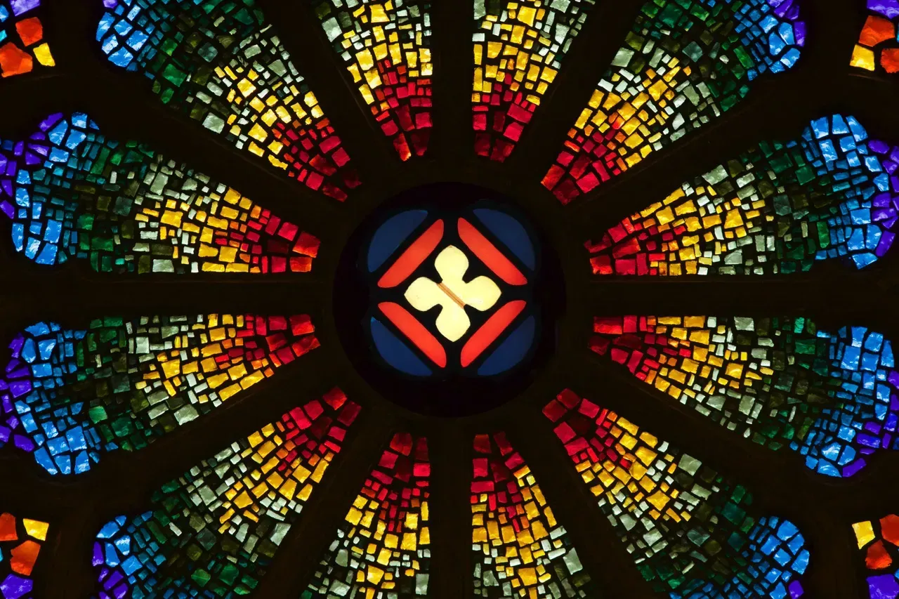 Rose Window with a cross of order in the center.
