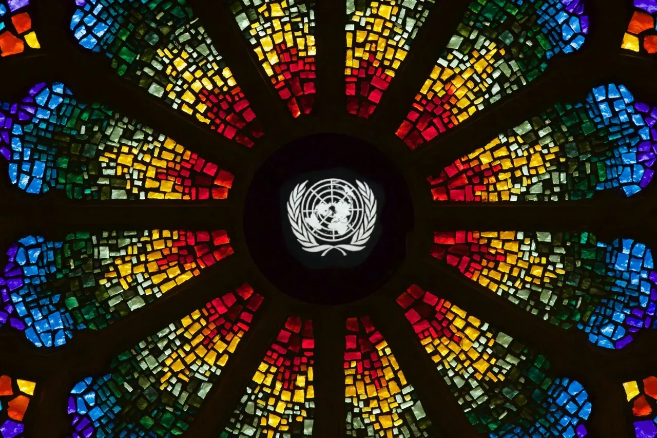 Rose window with the United Nations logo in the center.