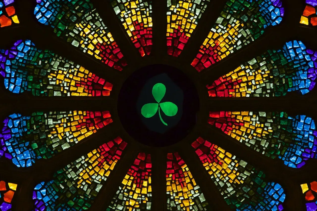 Rose window with a 3 leaf clover in the center.