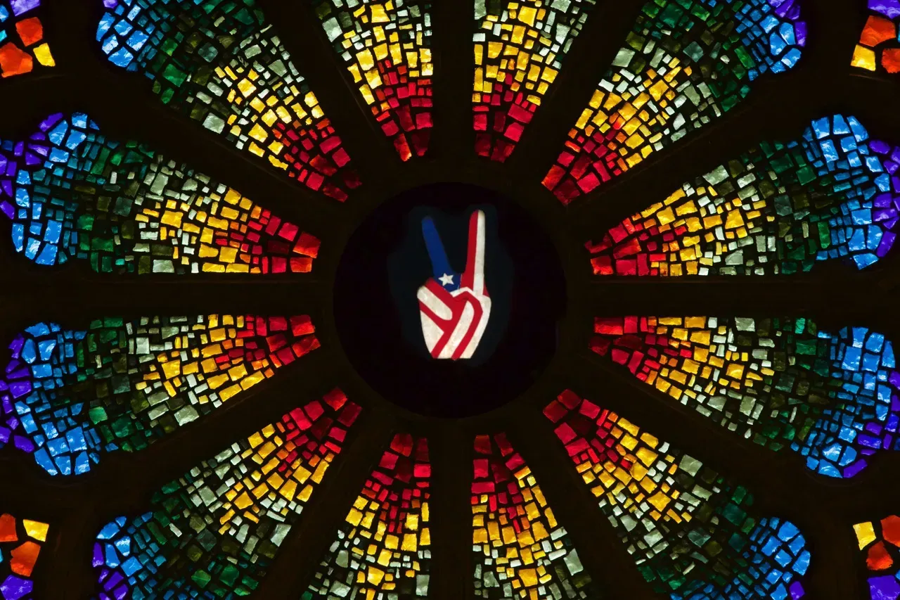 Rose Window with an American flag peace sign.