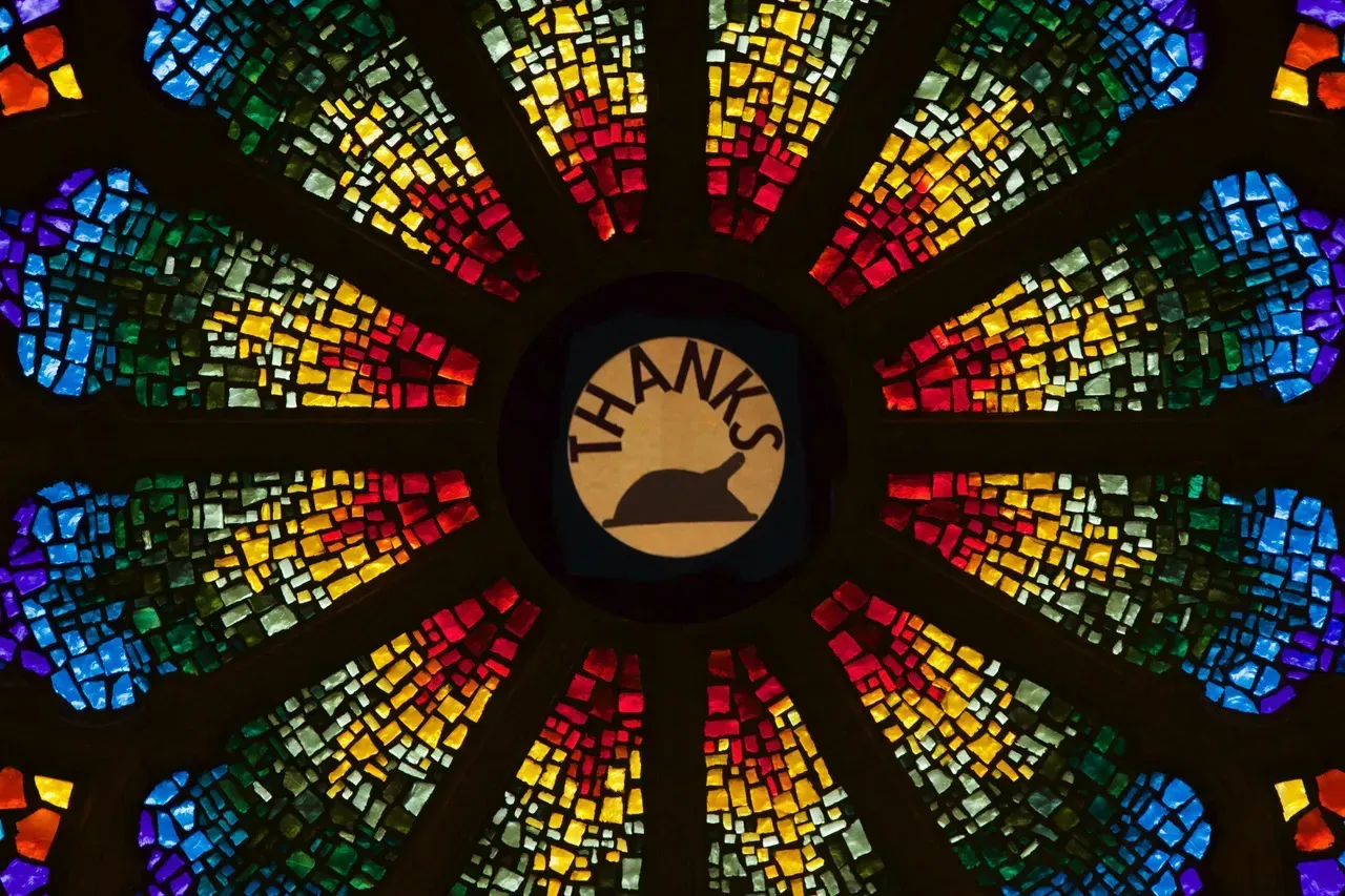 Rose Window with a turkey and the words Thanks in the center.