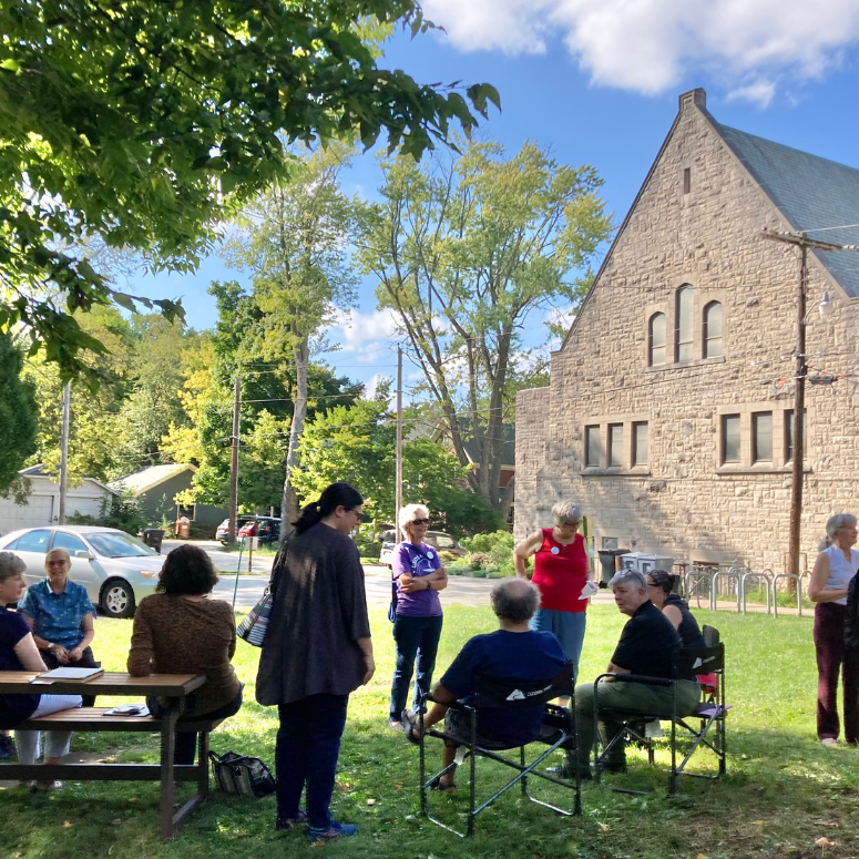 Gathering of congregants on the south lawn outside of the church.