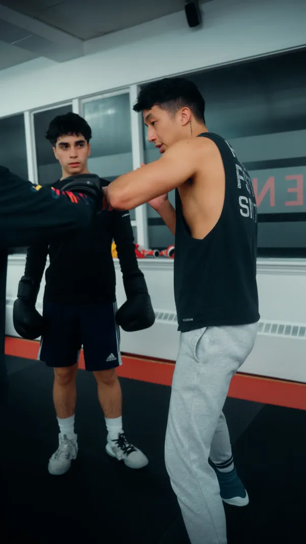 Private Boxing Coach Vancouver providing boxing lessons, boxing classes, boxing fitness, and boxing personal training for men and women. Boxing trainer Vancouver BC specializing in boxing for beginners, boxing sparring sessions, and boxing footwork drills. Boxing school and boxing academy offering boxing gym near me and boxing workout programs. Learn boxing techniques, boxing combinations, and boxing conditioning Vancouver. Boxing Coach Vancouver BC specializing in private boxing training, sparring, and padwork. Boxing gym near me offering boxing fitness, endurance, and agility drills. Boxing classes for adults, beginners, and competitive boxers. Boxing training Vancouver for power, speed, and confidence. Boxing Studio Vancouver BC with boxing trainers, boxing instructors, and boxing mentors. Boxing lessons including sparring, padwork, and technique training. Boxing conditioning classes for fitness, balance, and coordination. Boxing gym near me Vancouver offering boxing fundamentals and private coaching. Boxing Training New Westminster BC for beginners and advanced athletes. Boxing gym near Columbia Street with boxing coach and boxing personal trainer. Boxing private lessons New Westminster for sparring, padwork, and defense. Boxing fitness classes focused on endurance, confidence, and skill. Boxer throwing powerful punches during padwork training under bright gym lights. Boxing coach holding focus mitts with precision and control. Boxing fitness session emphasizing technique, timing, and power. Boxing gym atmosphere filled with discipline, endurance, and focus.
Boxing gloves striking the heavy bag in rhythmic combination drills. Boxing training session showing explosive energy and proper stance. Boxing gym filled with focus, sweat, and determination. Boxing conditioning workout for power, coordination, and speed.
Athlete shadowboxing in front of a mirror practicing jab and hook form. Boxing training improving timing, rhythm, and coordination. Boxing gym reflecting focus and mental strength. Boxing fitness developing technique, endurance, and control.
Boxer and coach engaged in one on one padwork session, sweat flying with each punch. Boxing training enhancing speed and defensive awareness. Boxing gym environment promoting hard work and intensity. Boxing fitness and technique merging into perfect form.
Close-up of boxing gloves wrapped tightly, symbolizing strength and focus. Boxing conditioning program building discipline and endurance. Boxing gym promoting resilience and skill mastery. Boxing training dedicated to physical and mental growth.
Boxing coach demonstrating footwork drills across the ring. Boxing student following precise steps for rhythm and control. Boxing fitness routine targeting balance and coordination. Boxing gym encouraging consistency and improvement.
Boxer practicing defensive slips and counterpunching drills under supervision. Boxing training focused on agility, reaction, and timing. Boxing gym with sparring partners improving awareness. Boxing conditioning enhancing precision and focus.
Sweat-drenched boxer throwing uppercuts during heavy bag workout. Boxing training combining power, cardio, and endurance. Boxing fitness for strength and speed development. Boxing gym atmosphere radiating determination and grit.
Boxer jumping rope in the ring during warm-up. Boxing training emphasizing rhythm, coordination, and stamina. Boxing fitness exercise for endurance and footwork control. Boxing gym filled with focus and movement.
Boxer performing core exercises after an intense sparring round. Boxing conditioning program improving recovery and resilience. Boxing gym environment filled with motivation and focus. Boxing fitness connecting strength, control, and discipline.