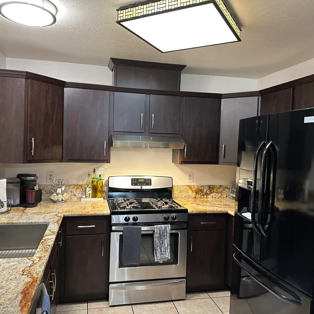 A kitchen with stainless steel appliances and granite counter tops