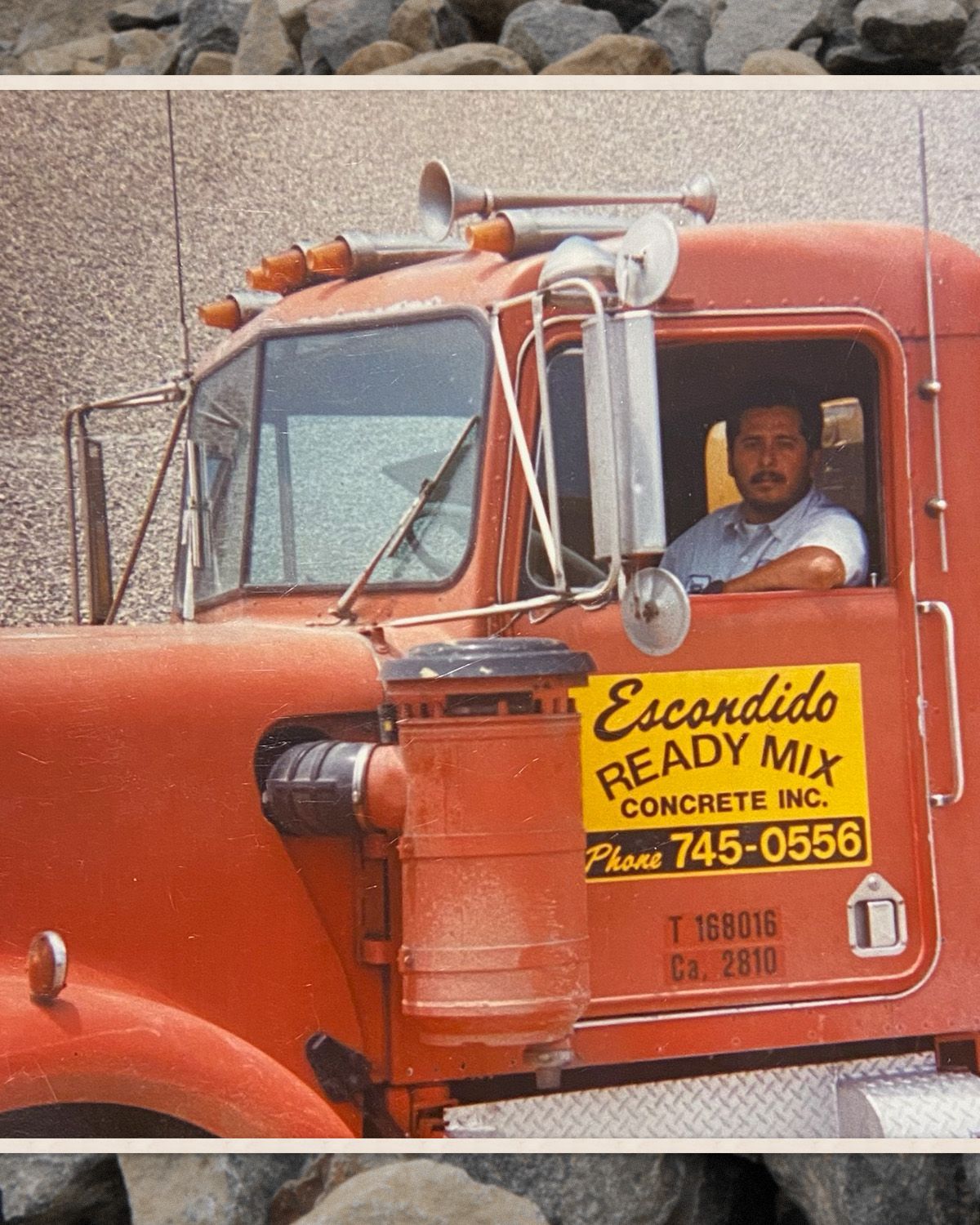A man is driving an orange truck that says escondido ready mix concrete inc.