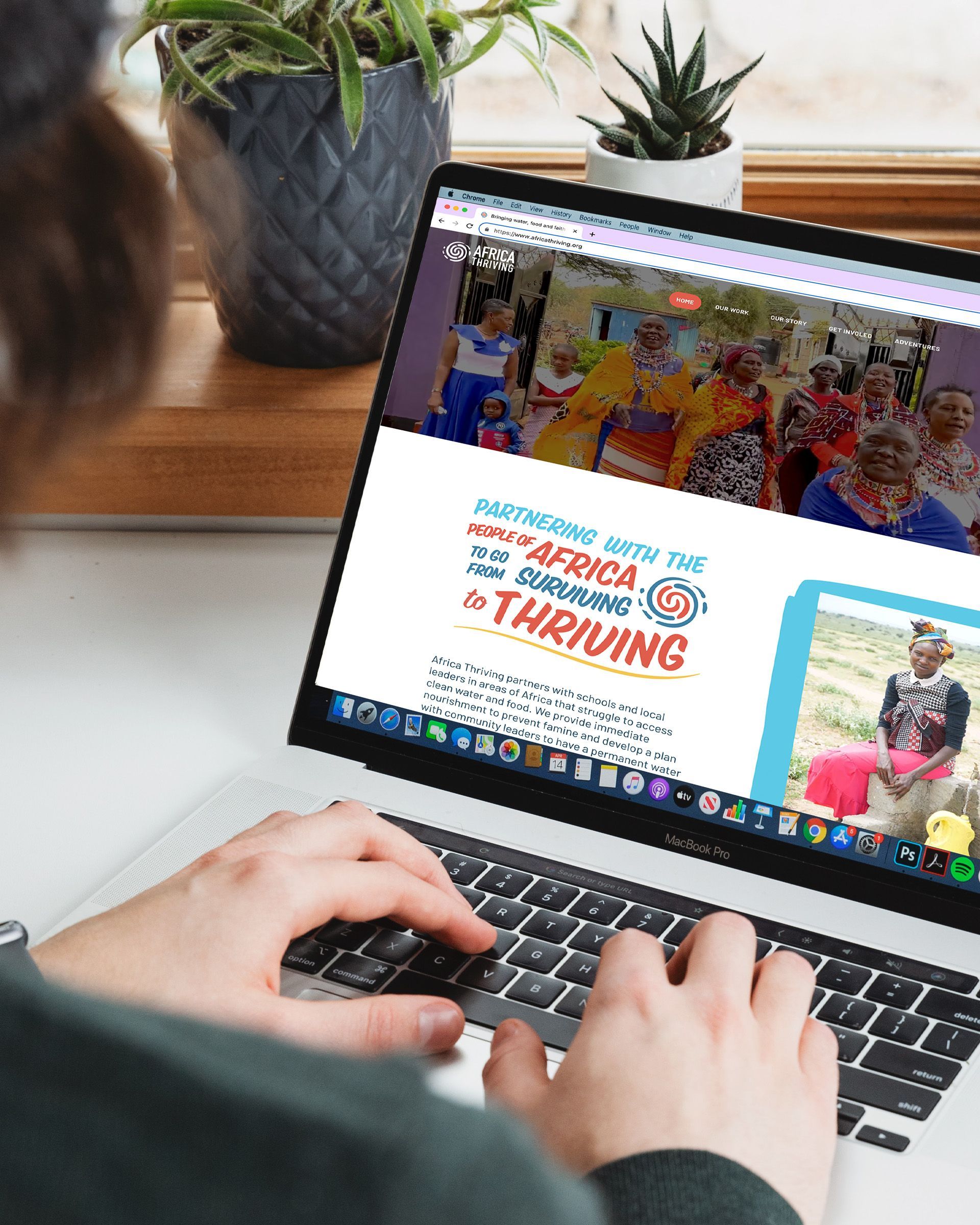 A person is typing on a laptop computer.