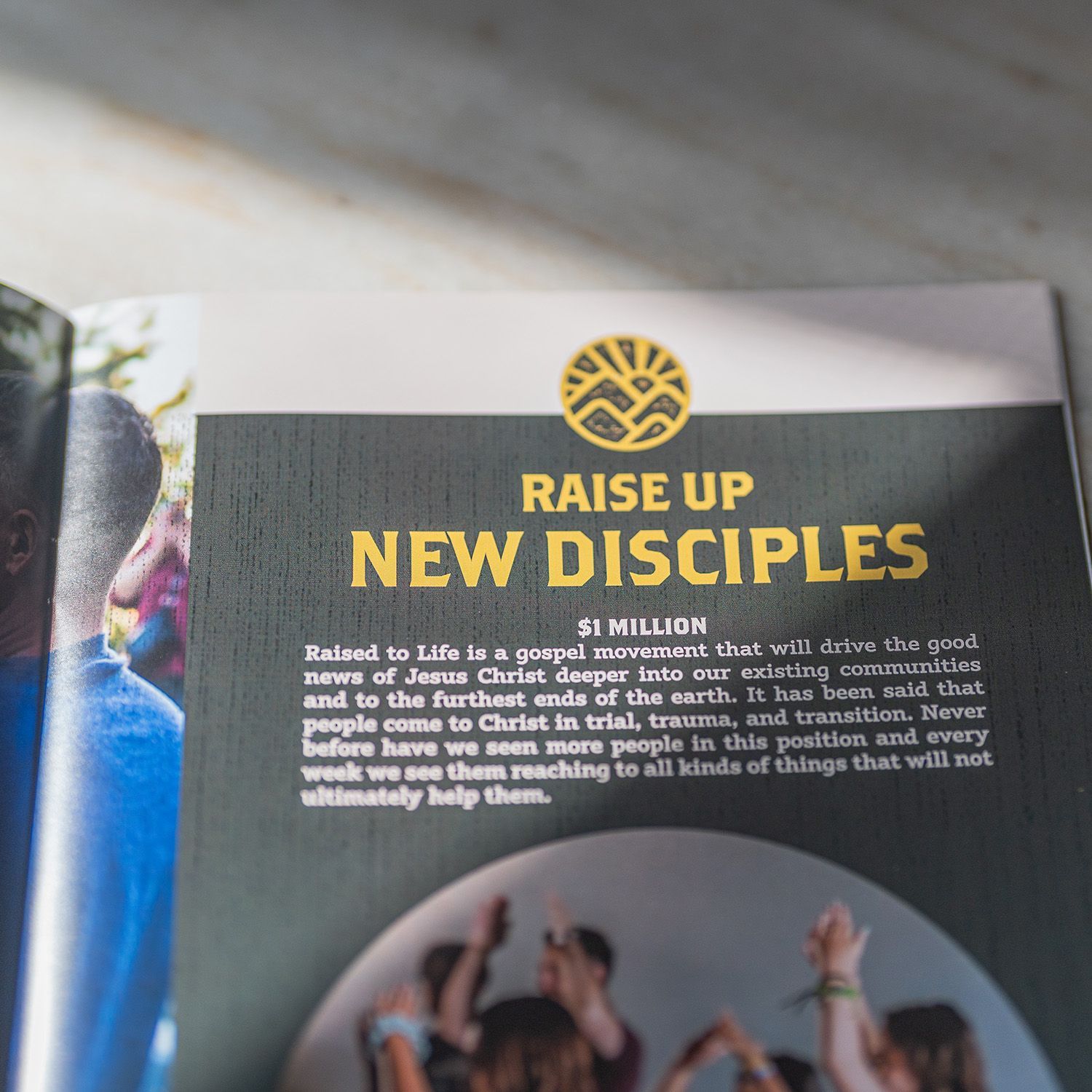 A book is open to a page that says raise up new disciples
