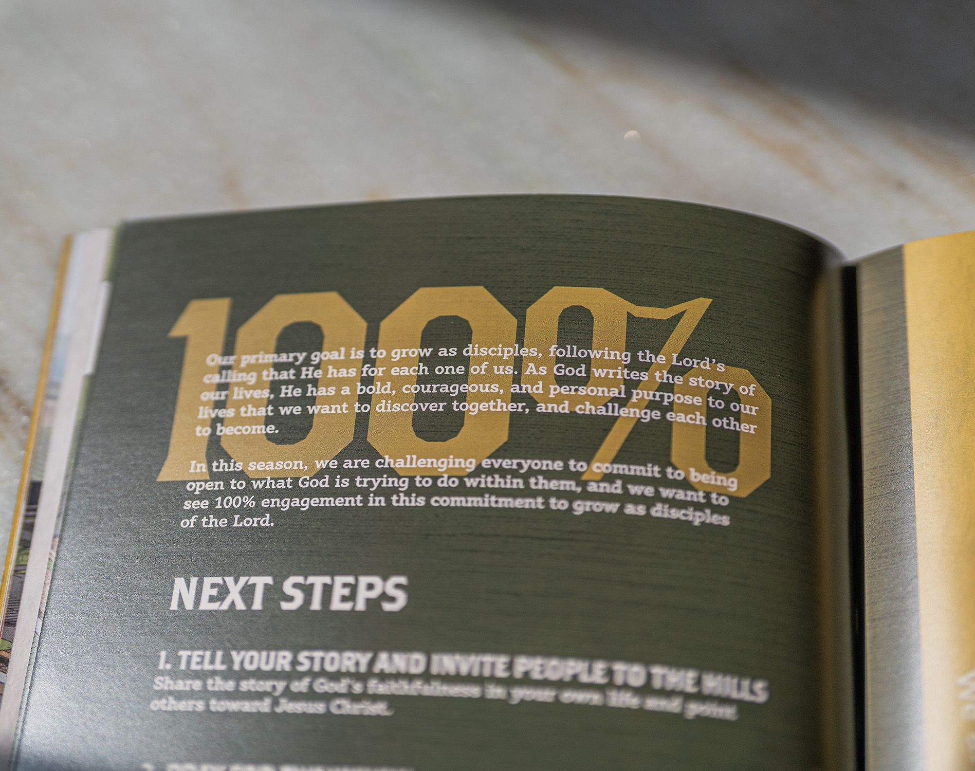 A book is open to a page that says next steps