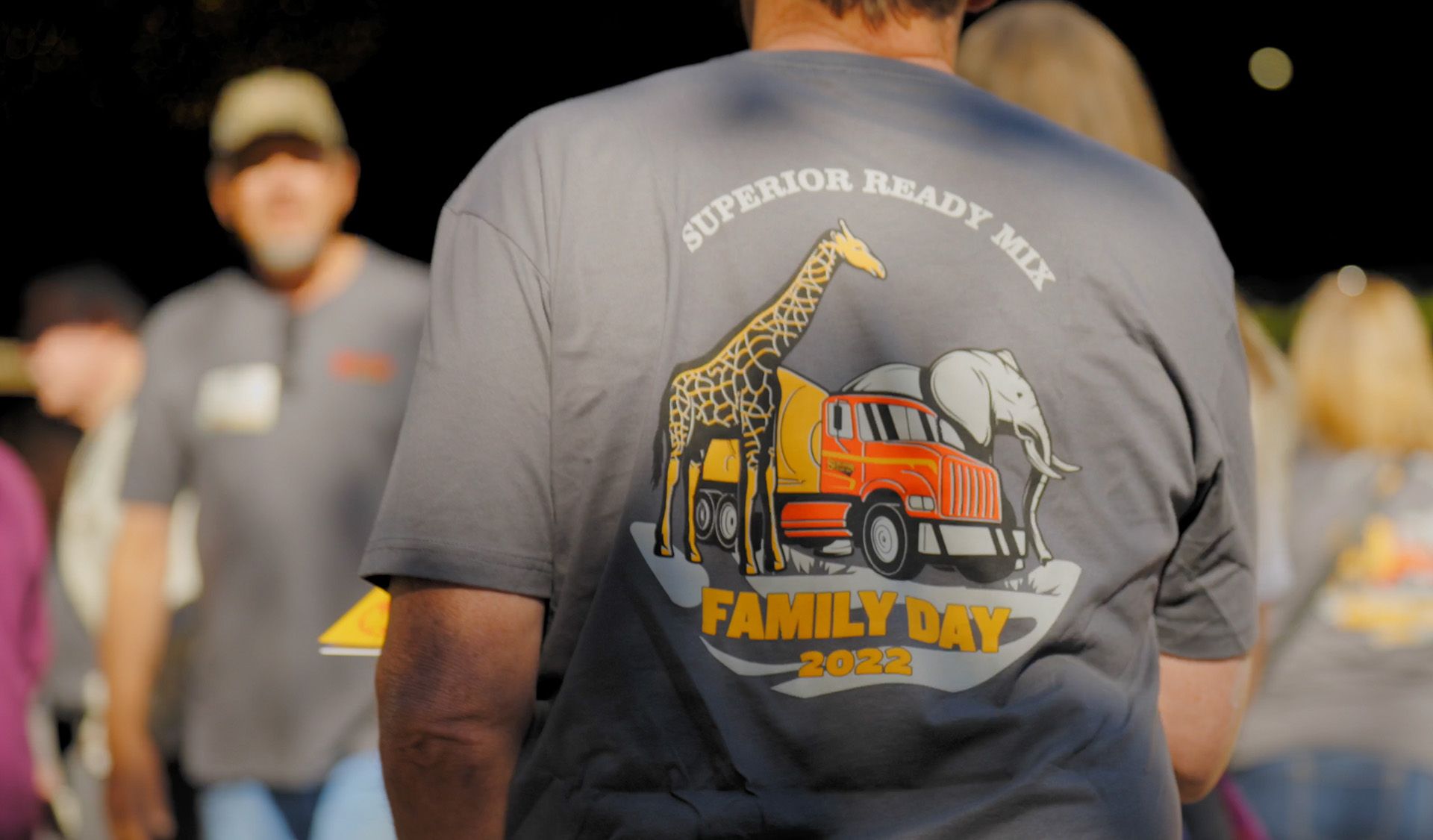 A man wearing a t-shirt that says superior ready mix