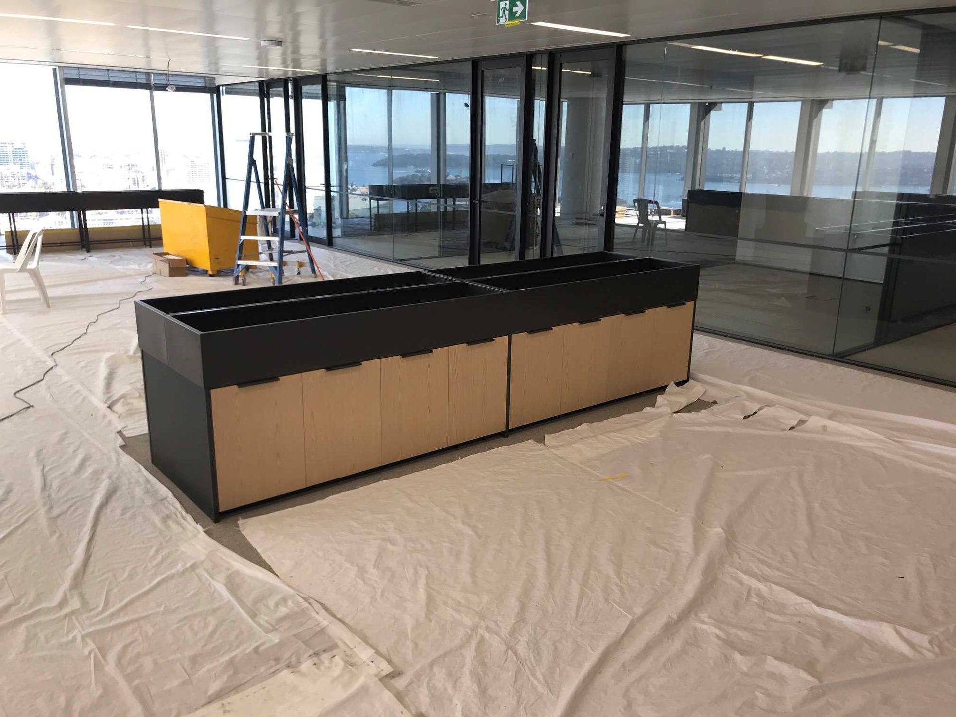 A Large Room With a Lot of Windows and a Table in the Middle of It — Concept Kitchens In Bonny Hills, NSW