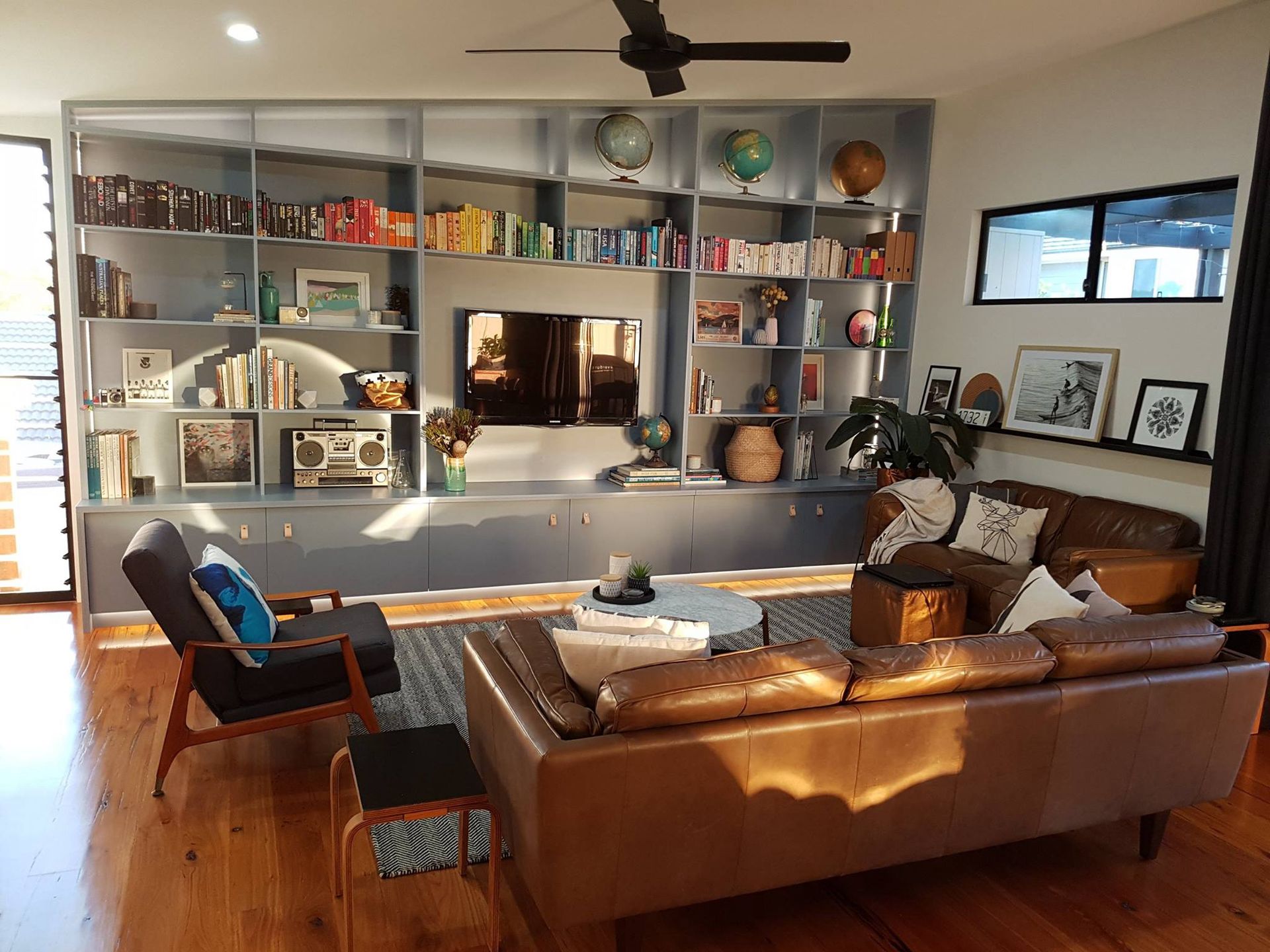 A living room filled with furniture and a ceiling fan. — Concept Kitchens In Port Macquarie, NSW