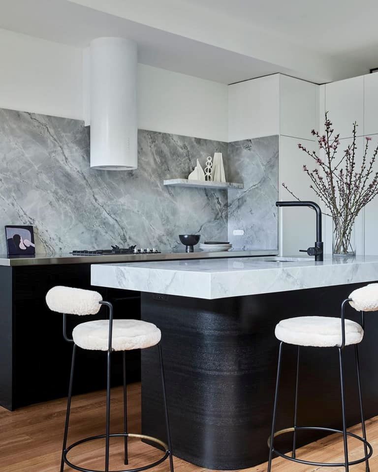 A Kitchen With a Marble Counter Top and Two Bar Stools — Concept Kitchens In Port Macquarie, NSW