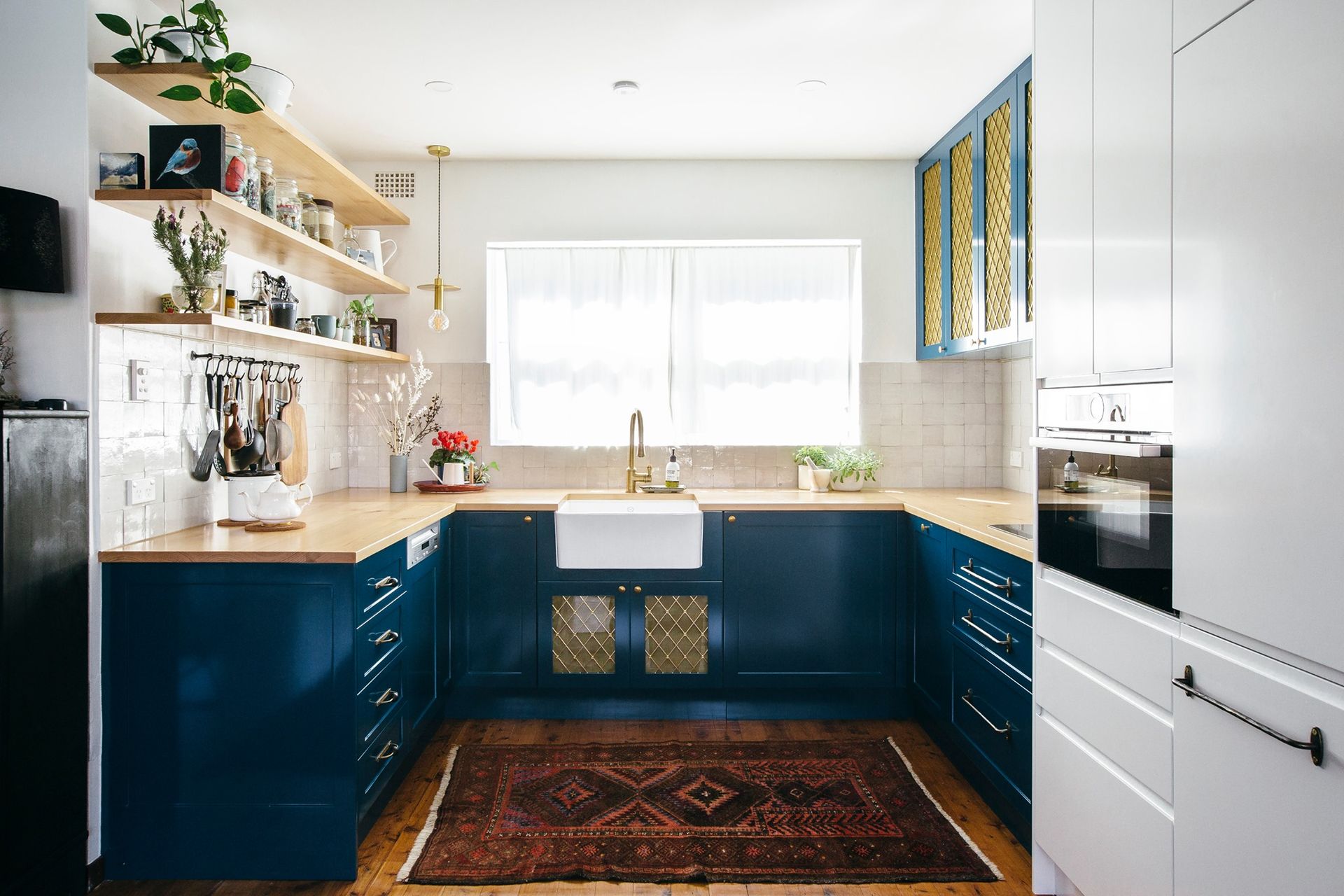 A Dining Room With a Table and Chairs in Front of a Kitchen — Concept Kitchens In Port Macquarie, NSW