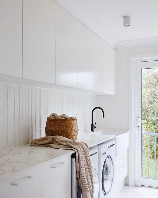 A Laundry Room With A Washing Machine and a Sink — Concept Kitchens In Port Macquarie, NSW