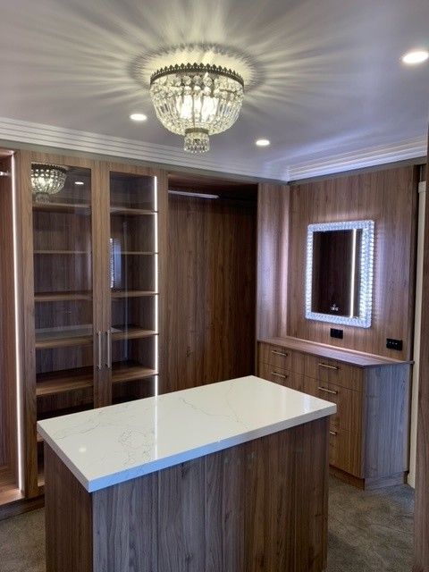 A Walk In Closet With Wooden Shelves— Concept Kitchens In Port Macquarie, NSW