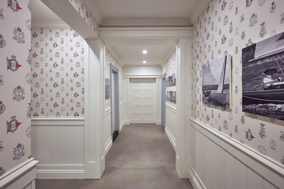 A White Hallway With A Lot Of Pictures On The Wall — Concept Kitchens In Port Macquarie, NSW