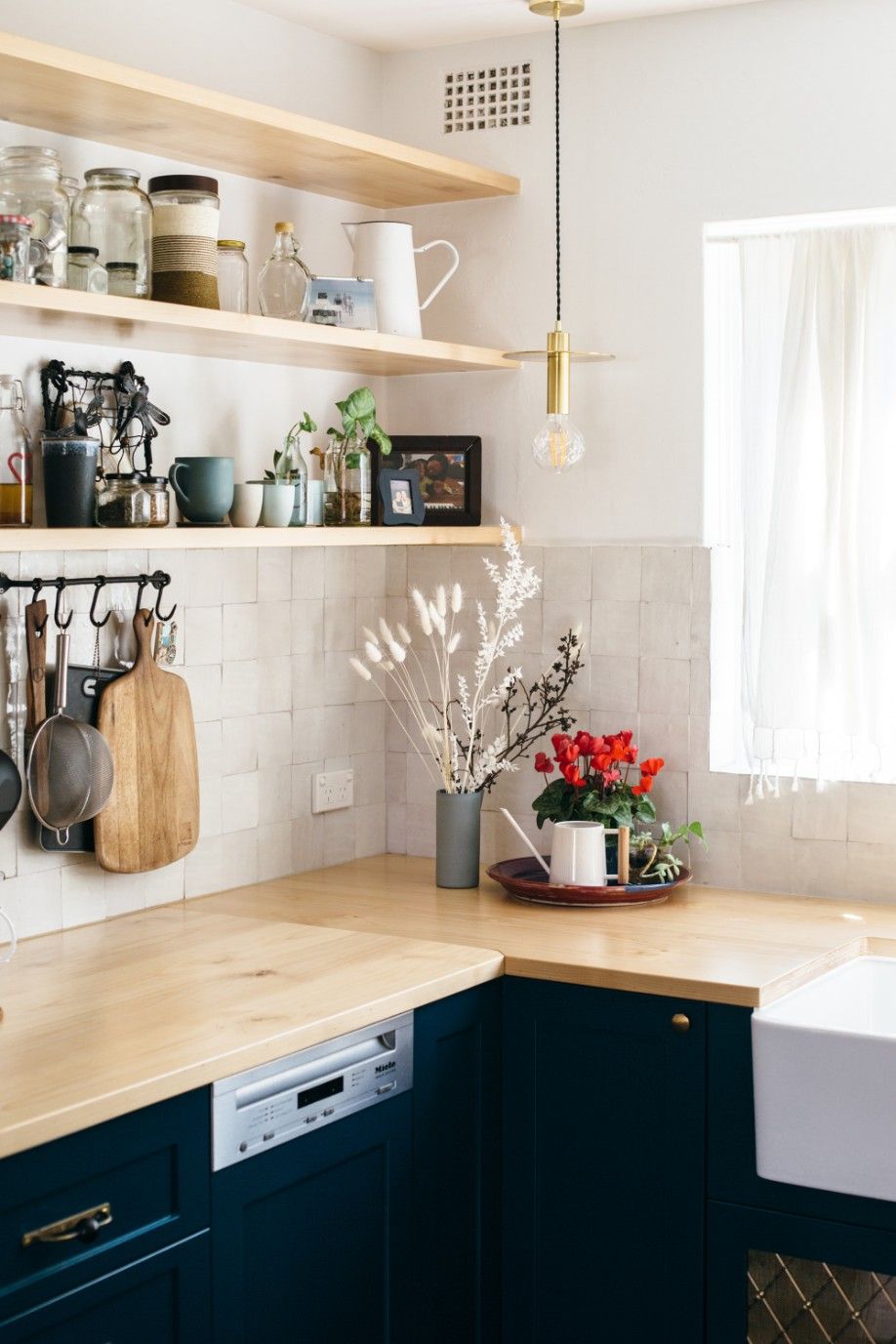 A Pleasantly Organized Kitchen With Blue Cabinets And Dark Blue Counter Tops — Concept Kitchens In Port Macquarie, NSW