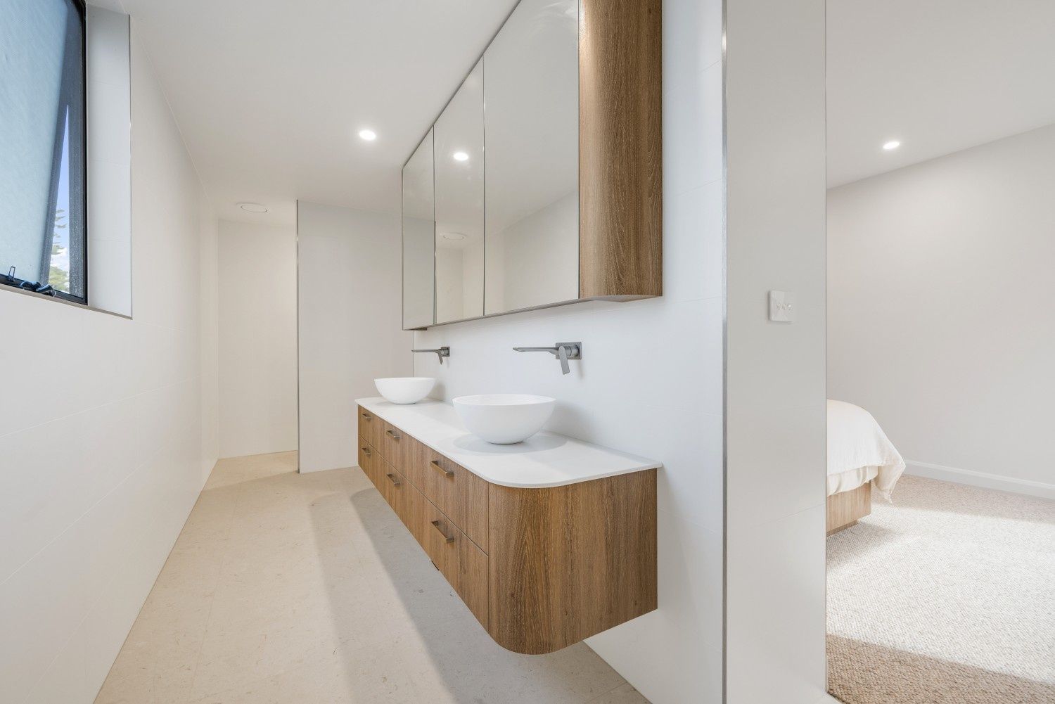 Modern Bathroom with Wood Vanity, White Sinks, and Large Mirror — Concept Kitchens In Port Macquarie, NSW