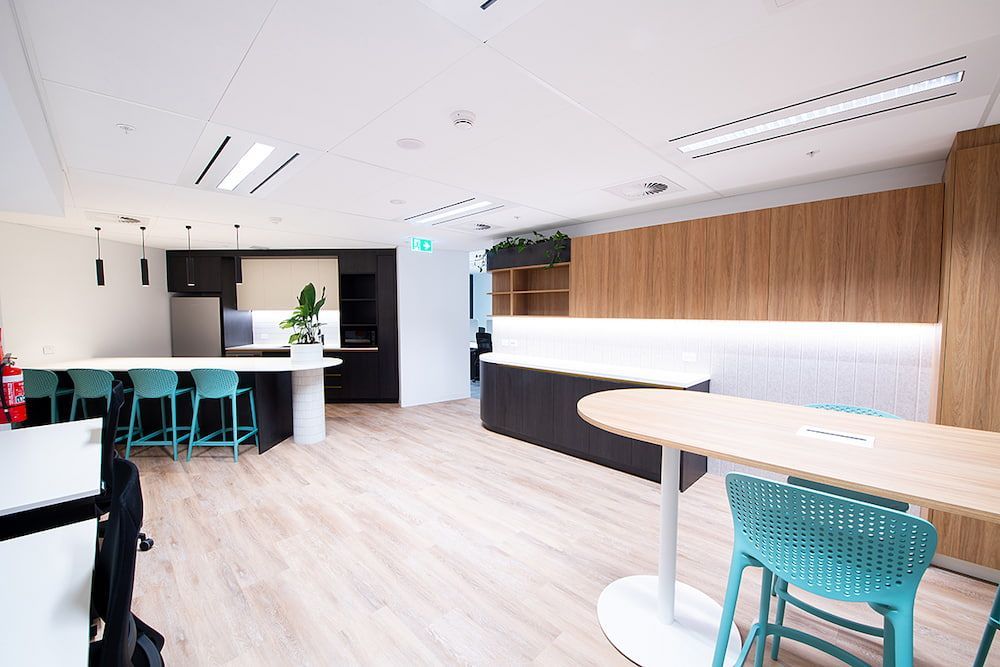 A Large Room With a Table and Chairs in It — Concept Kitchens In Port Macquarie, NSW