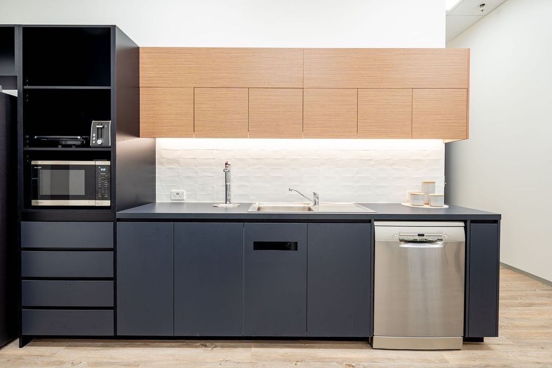 A Kitchen With Stainless Steel Appliances And Gray Cabinets — Concept Kitchens In Port Macquarie, NSW