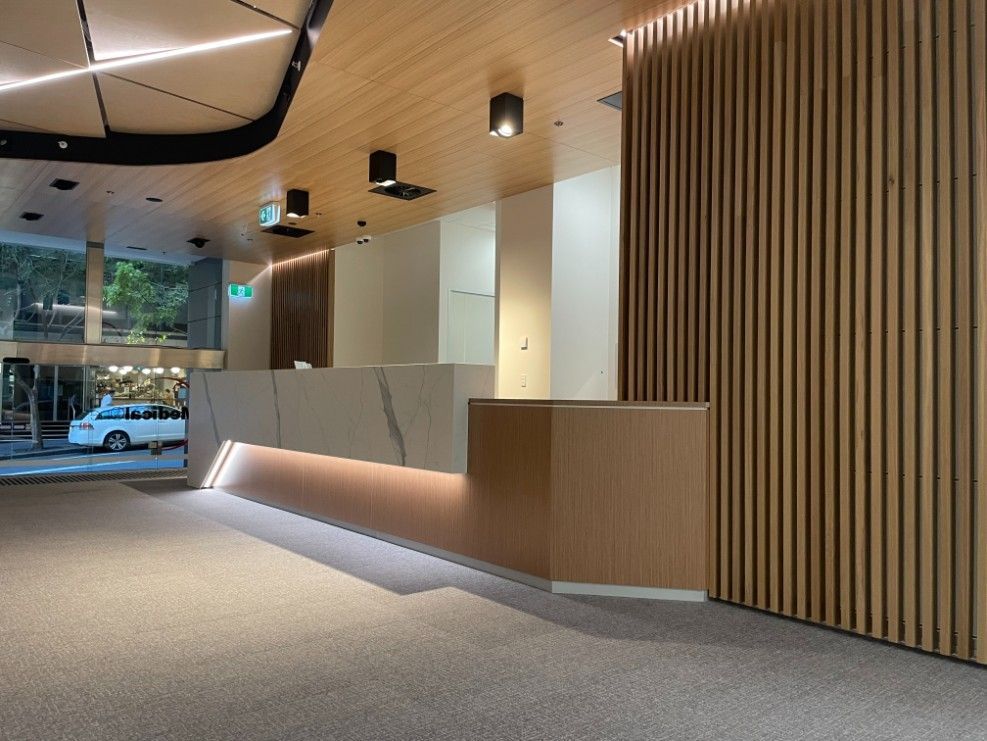 A Well-Lit Lobby With A Reception Desk And A Car Parked — Concept Kitchens In Port Macquarie, NSW