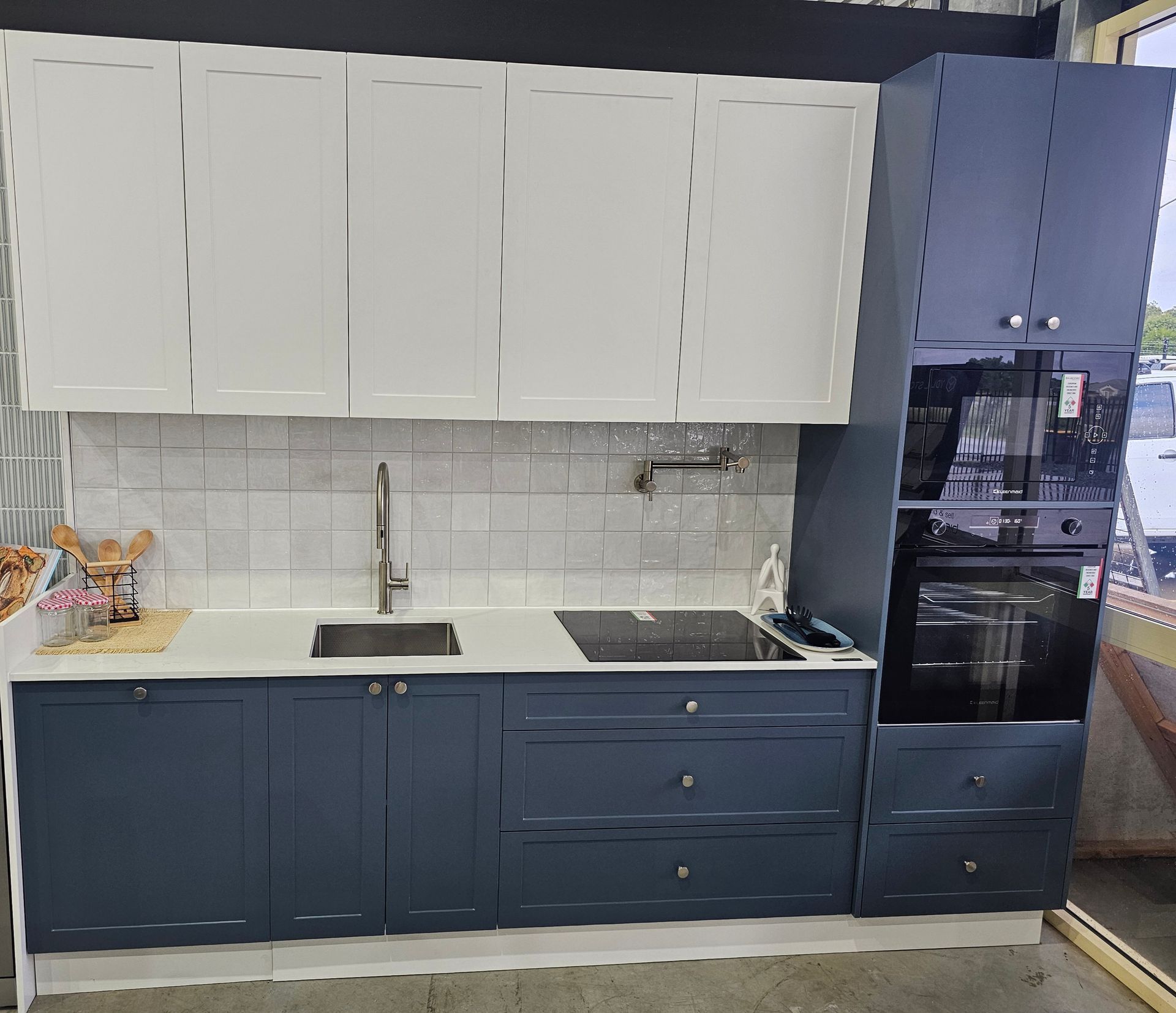 Modern Kitchen with White Upper Cabinets, Navy Lower Cabinets, White Backsplash — Mid Coast Tile Co in Taree, NSW