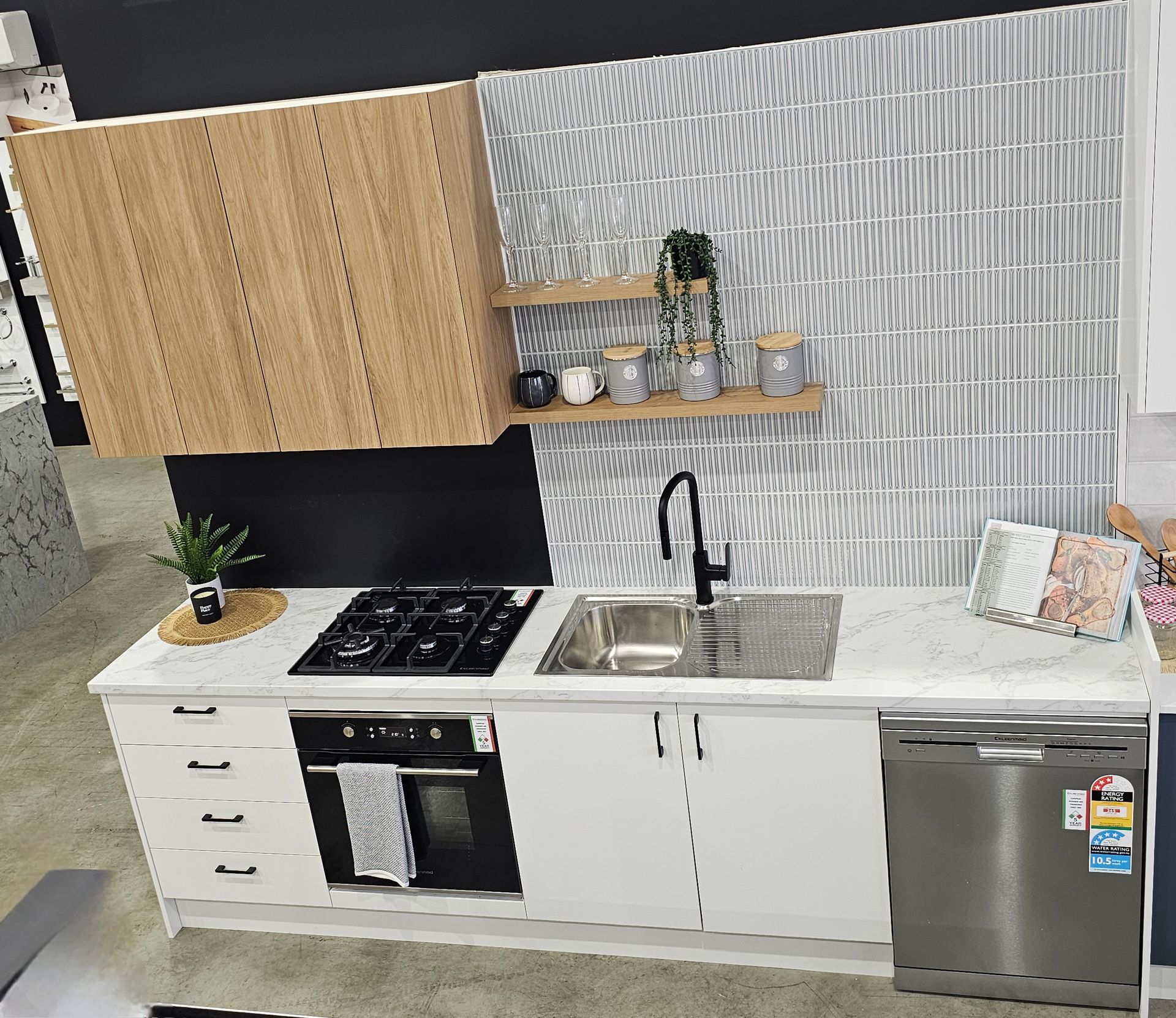 Compact Modern Kitchen with Wood Cabinets, White Counters, Stainless Appliances — Mid Coast Tile Co in Taree, NSW