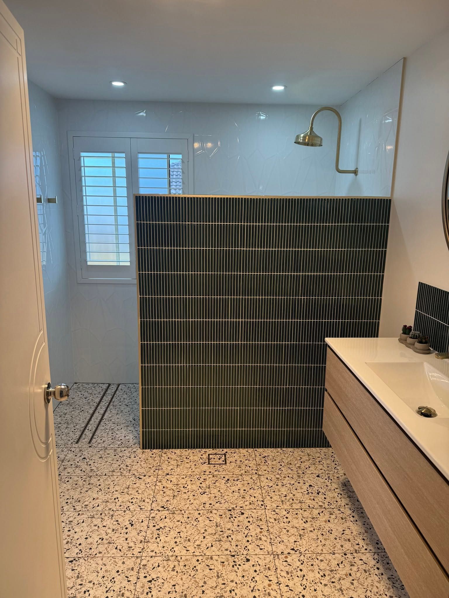Bathroom with A Shower Enclosure, Striped Panel, Speckled Floor — Mid Coast Tile Co in Taree, NSW
