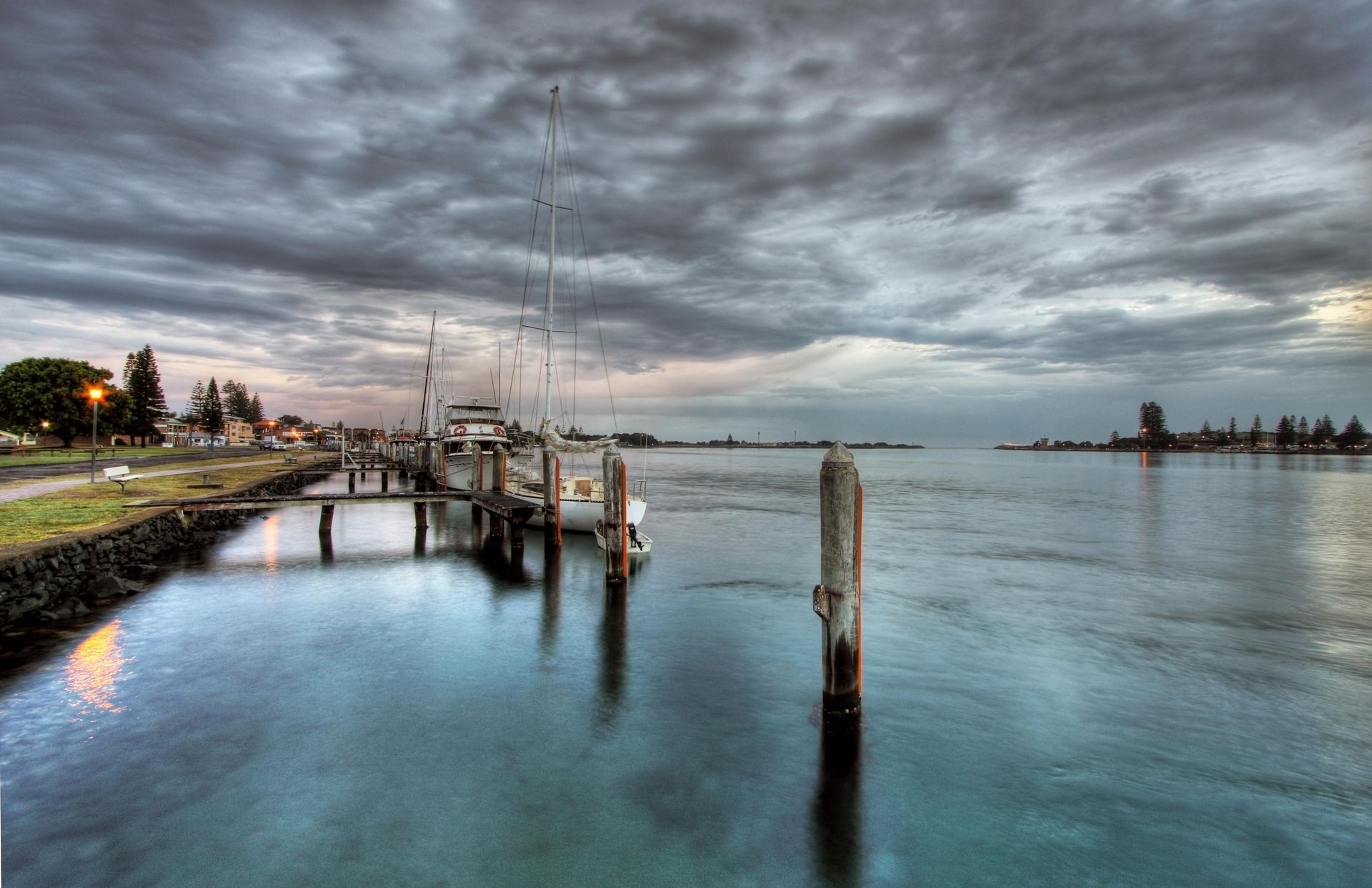 Calm Waterfront Marina at Dusk with Cloudy Sky, Dock Posts — Mid Coast Tile Co in Forster, NSW