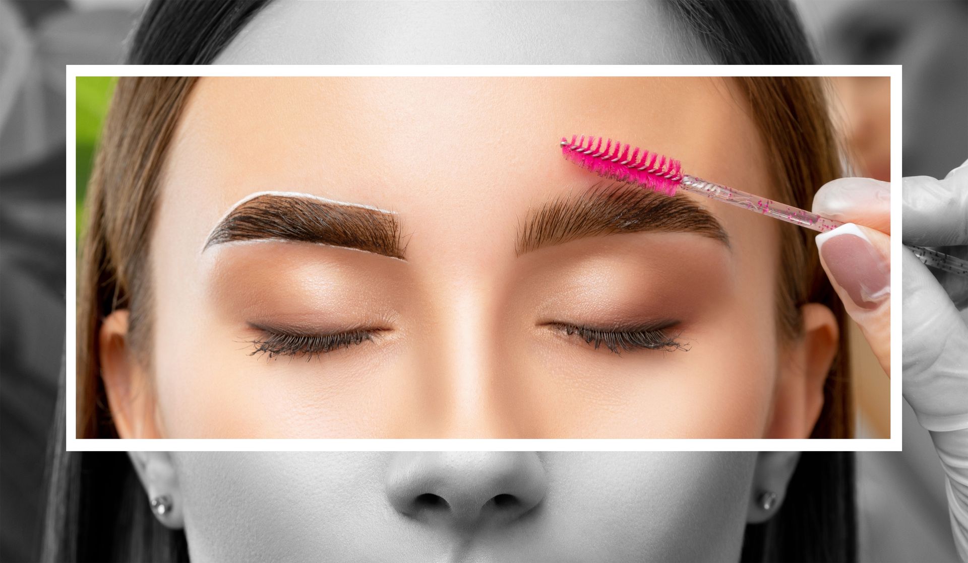 A woman is getting her eyebrows painted with a pink brush.