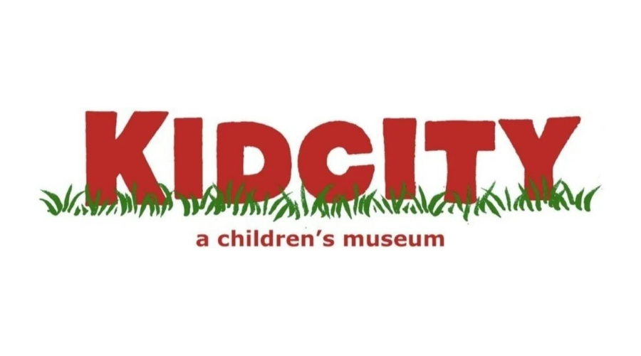 Kidcity logo in red with green grass and the tagline “a children’s museum”
