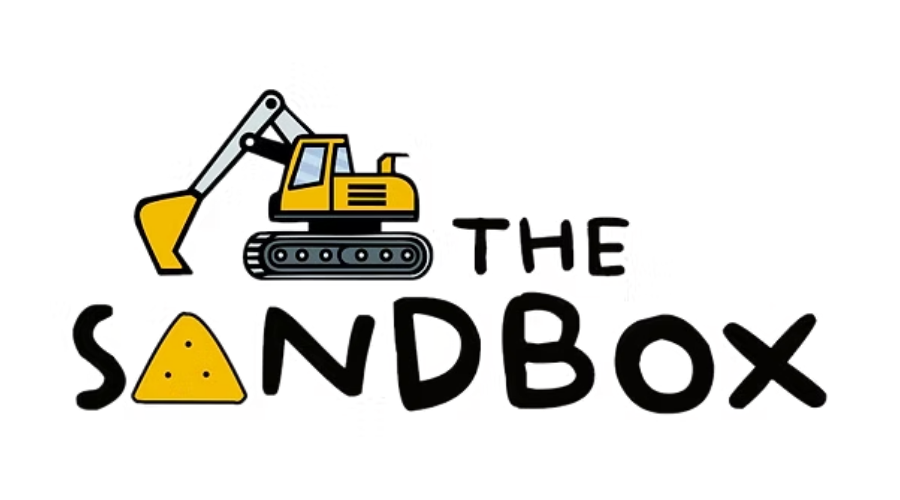 The Sandbox logo with a yellow excavator over black text and a yellow sand pile for the 