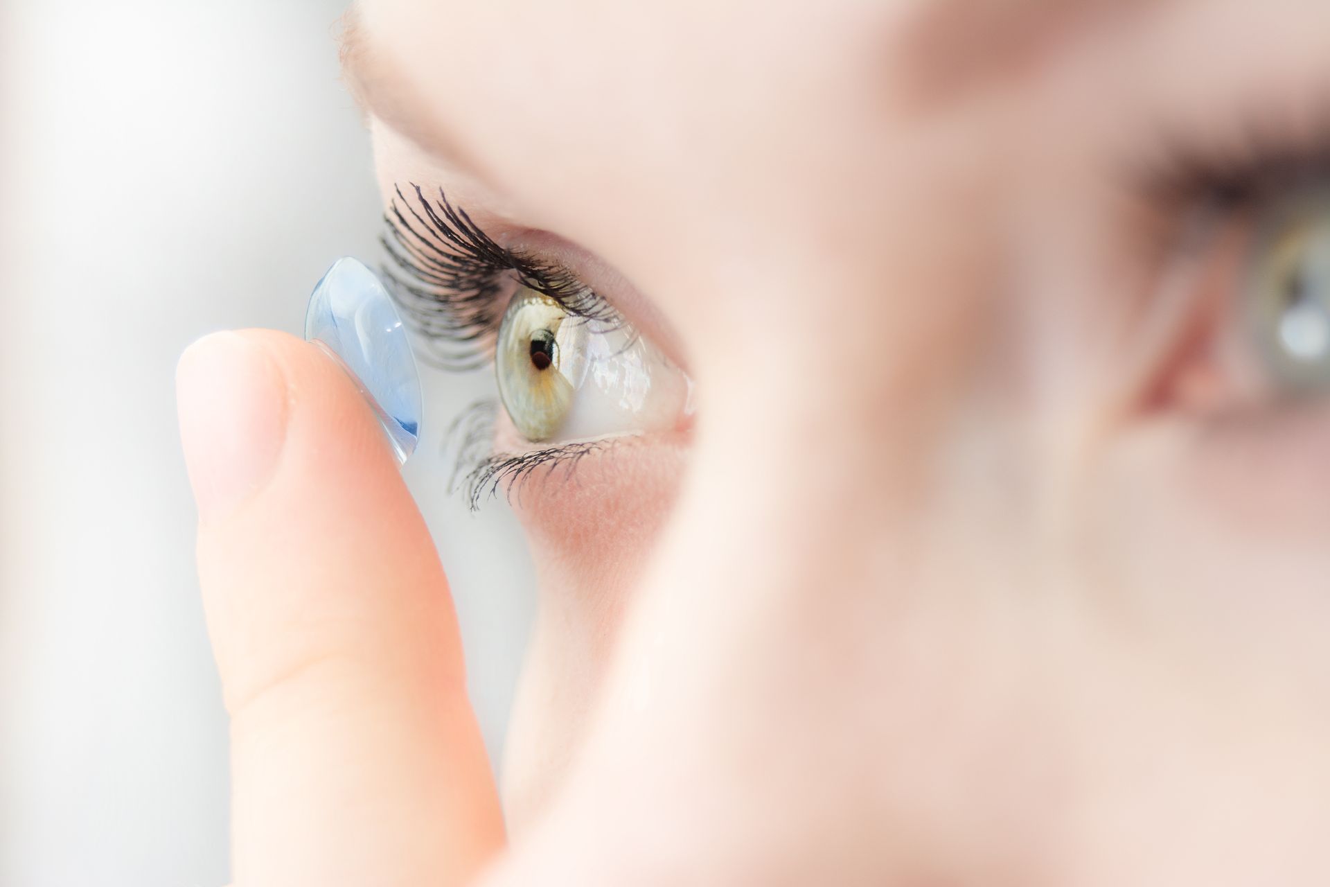 girl wearing soft contact lenses close-up macro