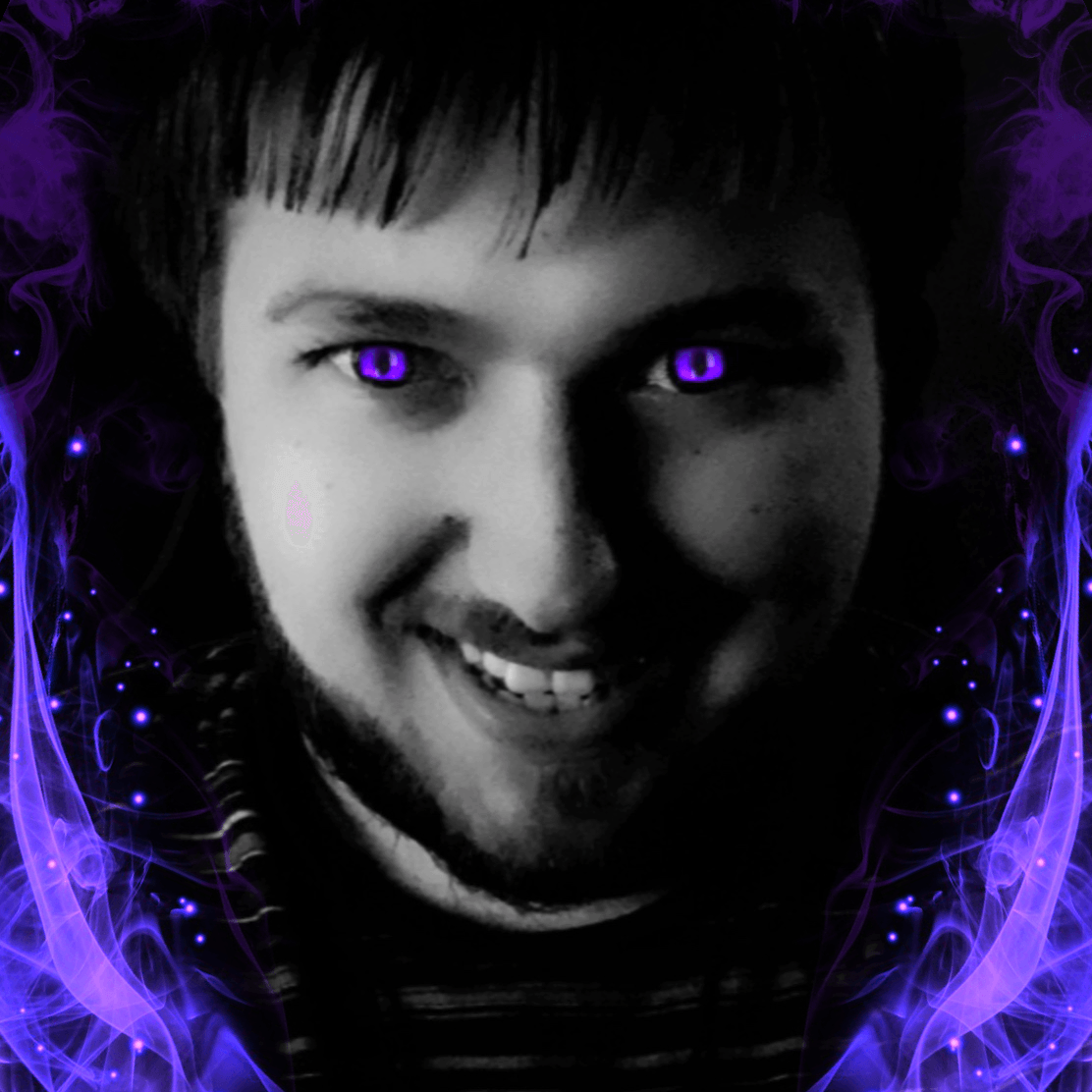 A man with purple eyes is smiling in a black and white photo.