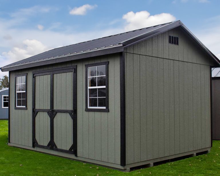 Gray garden shed with double doors, black trim, and a dark shingled roof on a grassy lawn