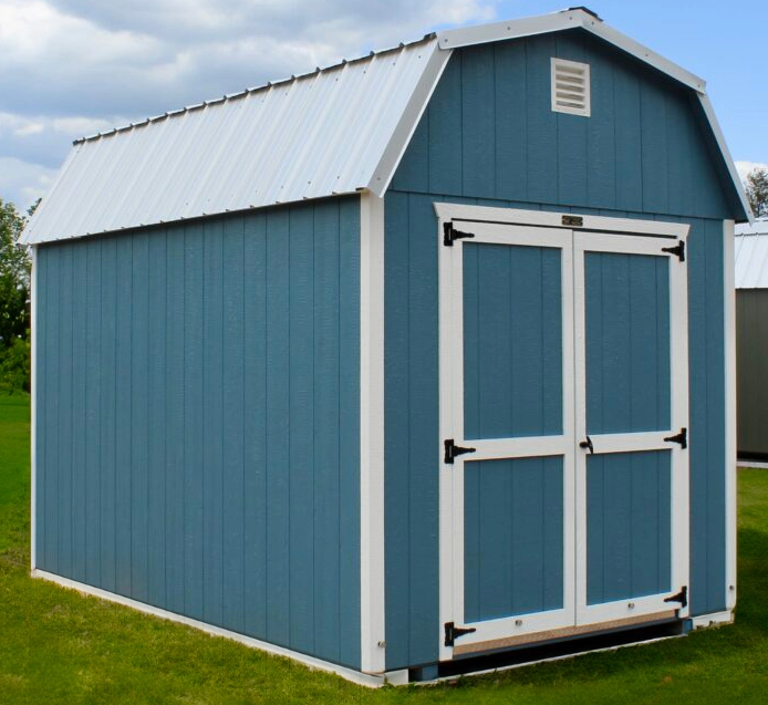 Blue wooden garden shed with white trim and double doors on a grassy lawn