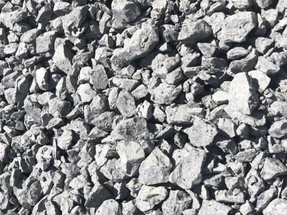Close-up of gray crushed stones and gravel filling the frame
