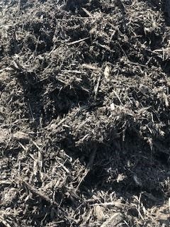 Close-up of dried grass and plant debris piled on the ground