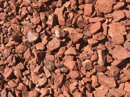 Close-up of reddish-brown gravel stones filling the frame