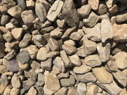 Pile of tan and gray rocks filling the frame