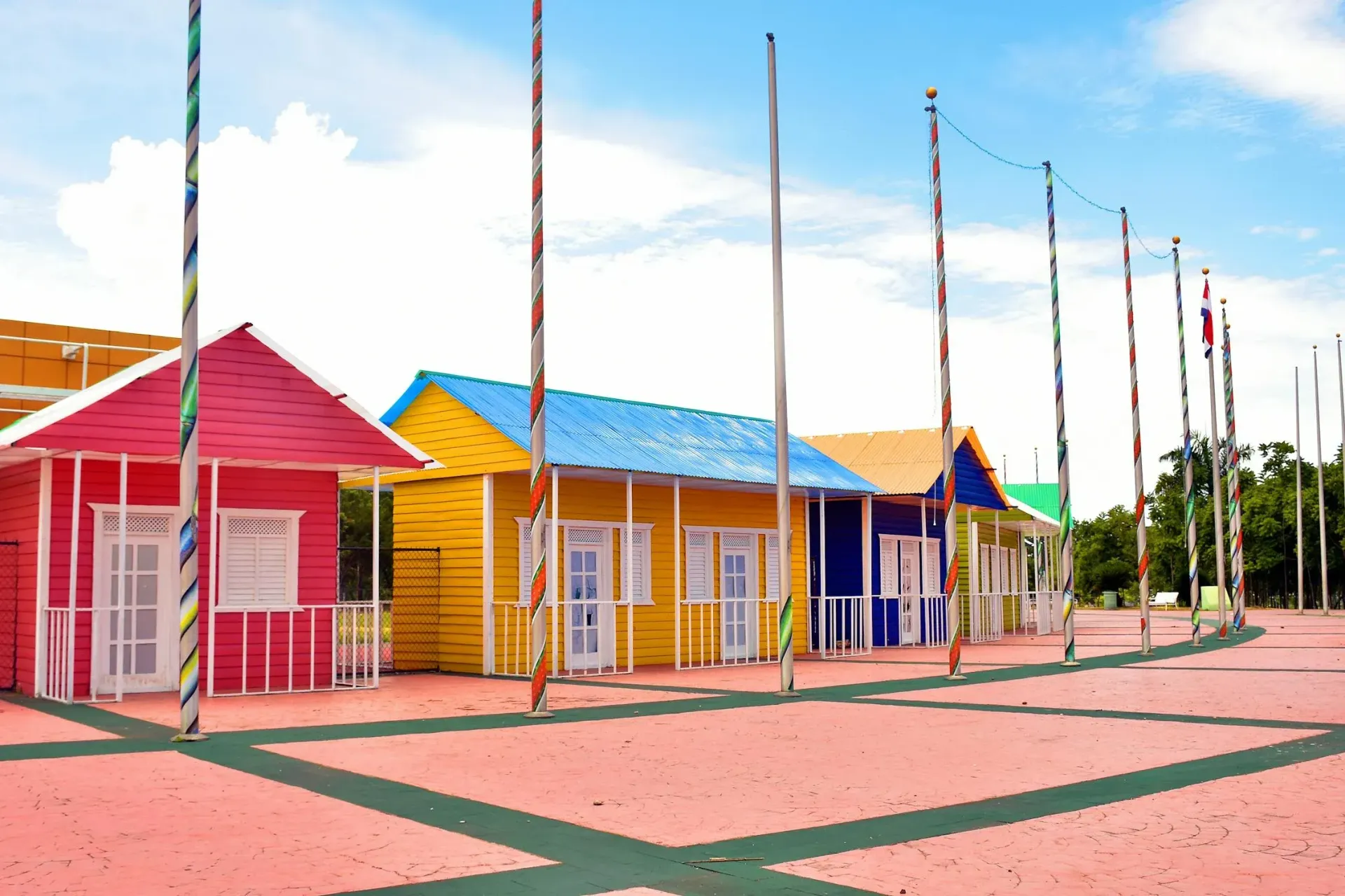 Row of houses in a park with facades of different colors