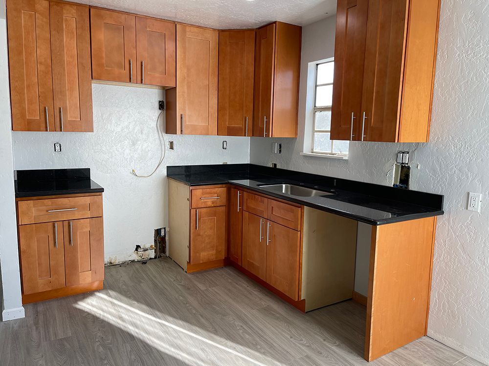 Wood kitchen cabinet installation in progress