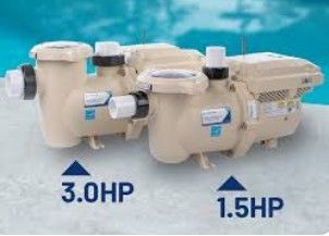 Two beige pool pumps labeled 3.0 HP and 1.5 HP, beside a blue pool.