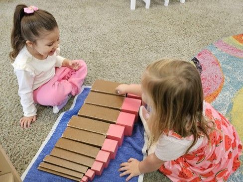 montessori children working on Pink Tower Broad Stair