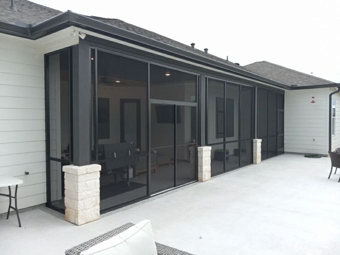 Professional screened-in patio enclosure in Central Texas designed to keep out insects and debris.